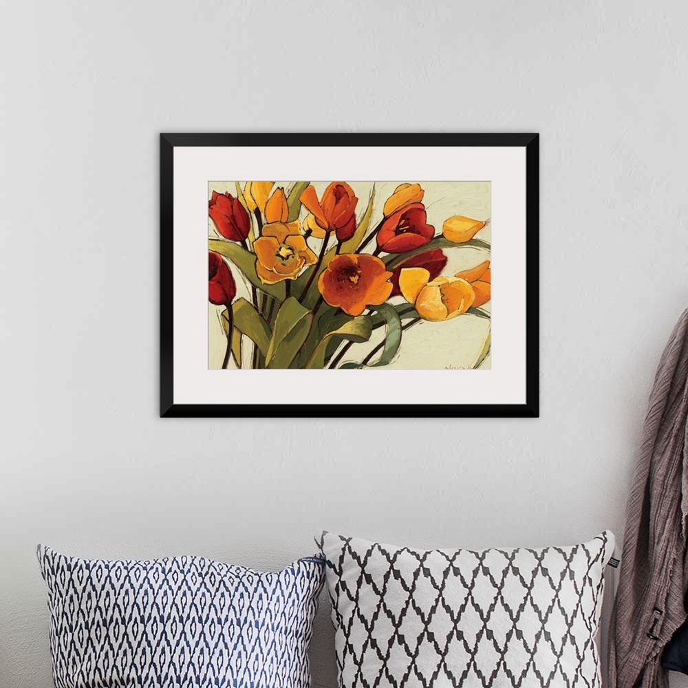 A bohemian room featuring A horizontal painting that is a close up of a floral arrangement with warm, sunshiny colors.