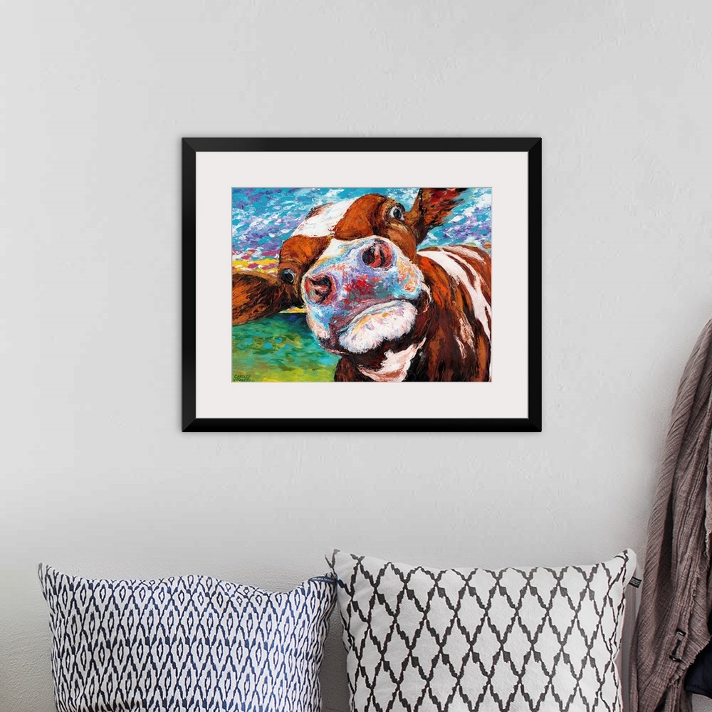 A bohemian room featuring A whimsical close up portrait of a brown and white cow sticking it's nose right up against the vi...