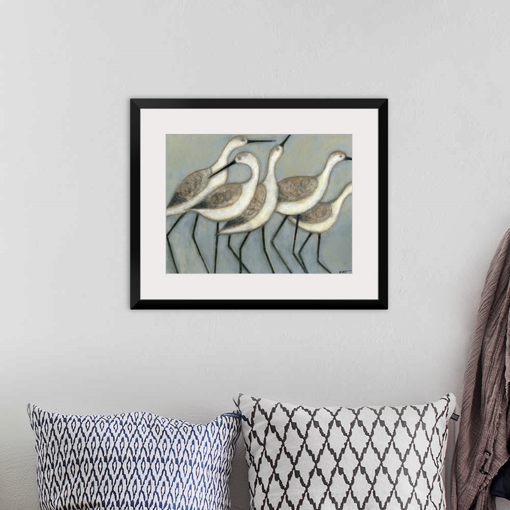 A bohemian room featuring A group of wader birds stand next to each other against a cool toned background.