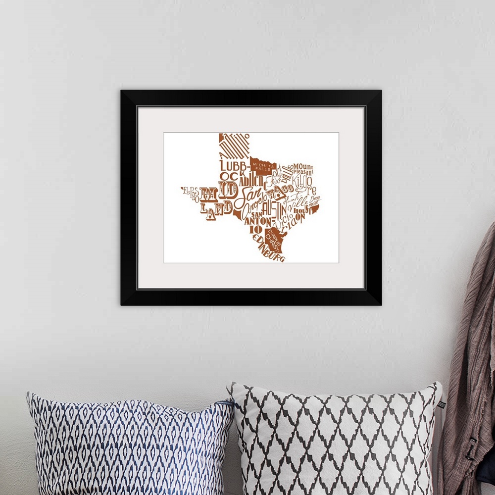 A bohemian room featuring Contemporary painting using typography to make the shape of the state of Texas.
