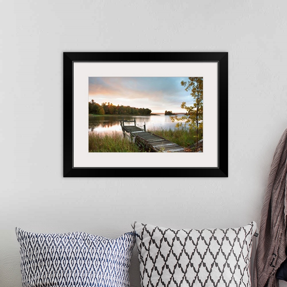 A bohemian room featuring A Dock On A Lake At Sunrise Near Wawa; Ontario, Canada
