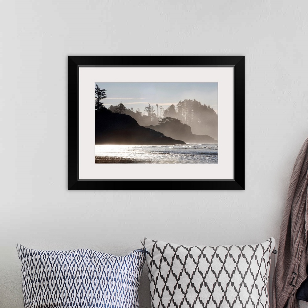A bohemian room featuring Mist rises of the sea against the silhouettes of rocks and trees in this shore line photograph ta...
