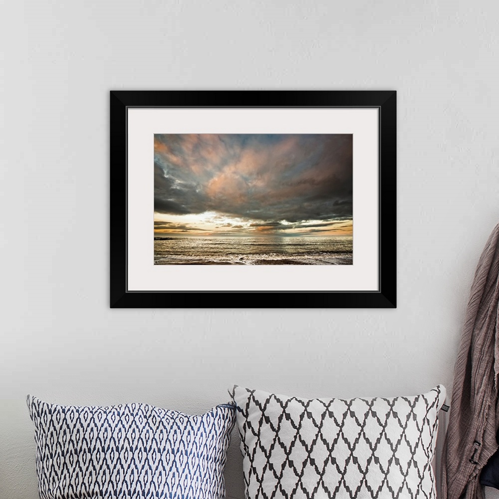 A bohemian room featuring Dramatic clouds at sunset over the water. South Shields, Tyne and Wear, England.