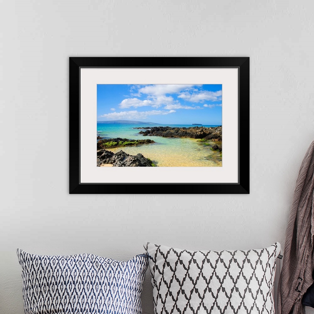 A bohemian room featuring Photograph of rocky shoreline with crystal clear water and mountains in the distance under a clou...