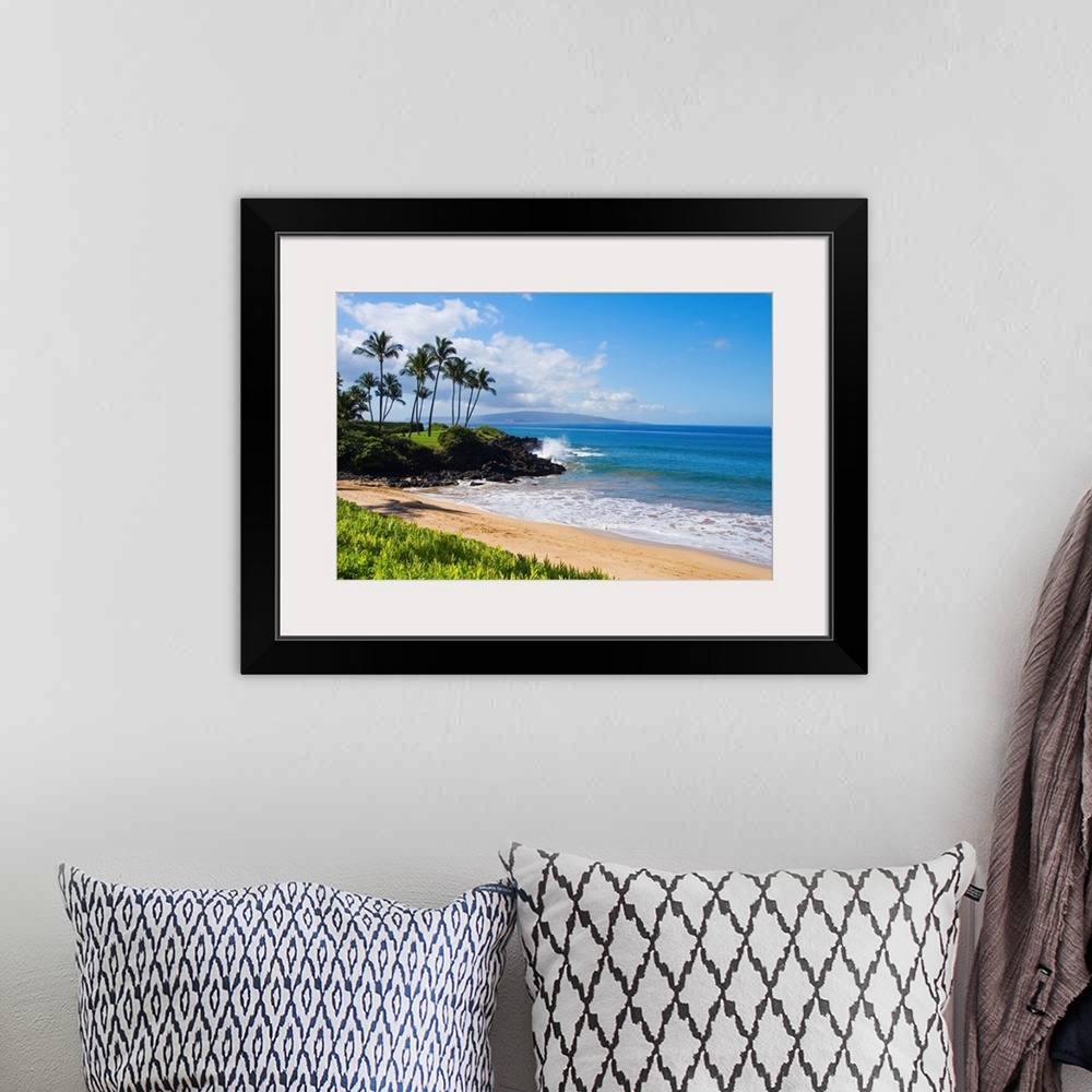 A bohemian room featuring An idyllic photograph of the Hawaiian coast, with gently lapping water under a bright blue sky. T...