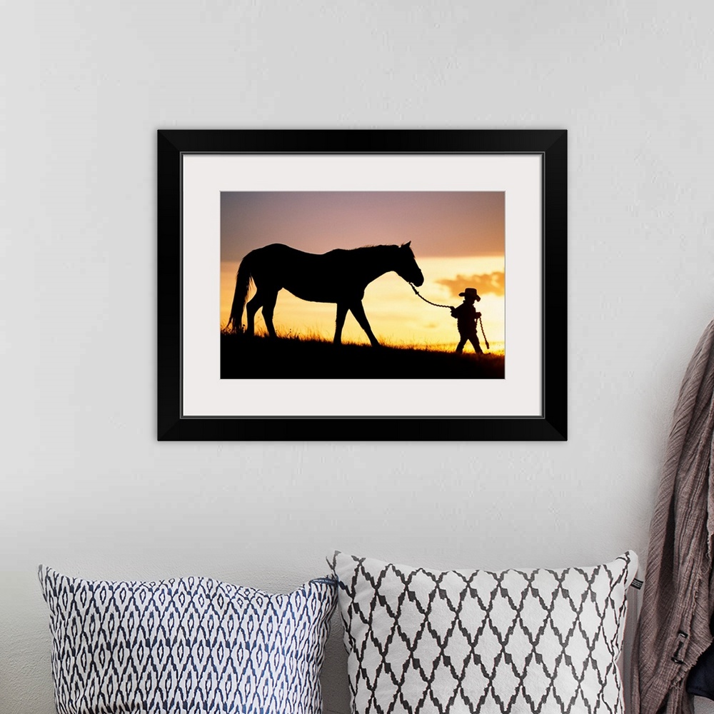 A bohemian room featuring This is a landscape photograph of a small child walking down a hill at twilight making it perfect...
