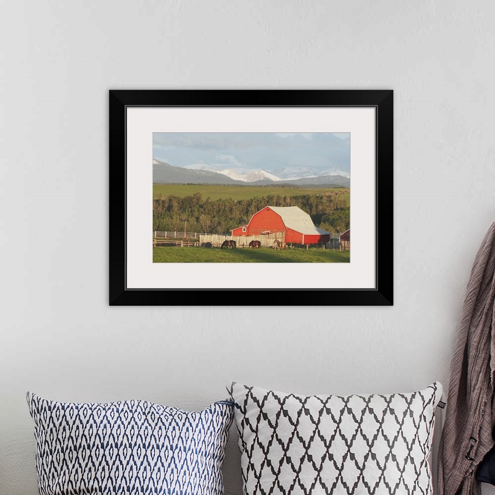 A bohemian room featuring Red Barn With Horses Grazing