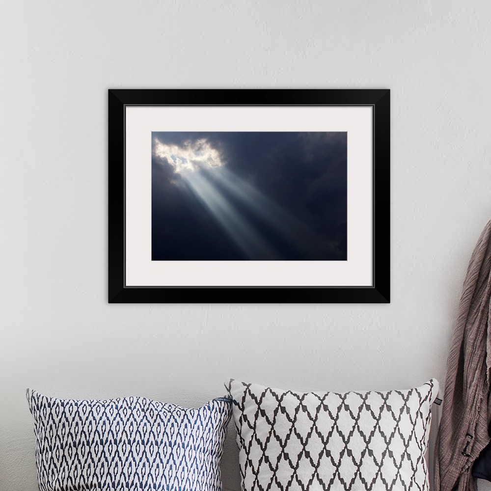 A bohemian room featuring Sunlight breaking through dark storm clouds, Georgetown, Ontario, Canada