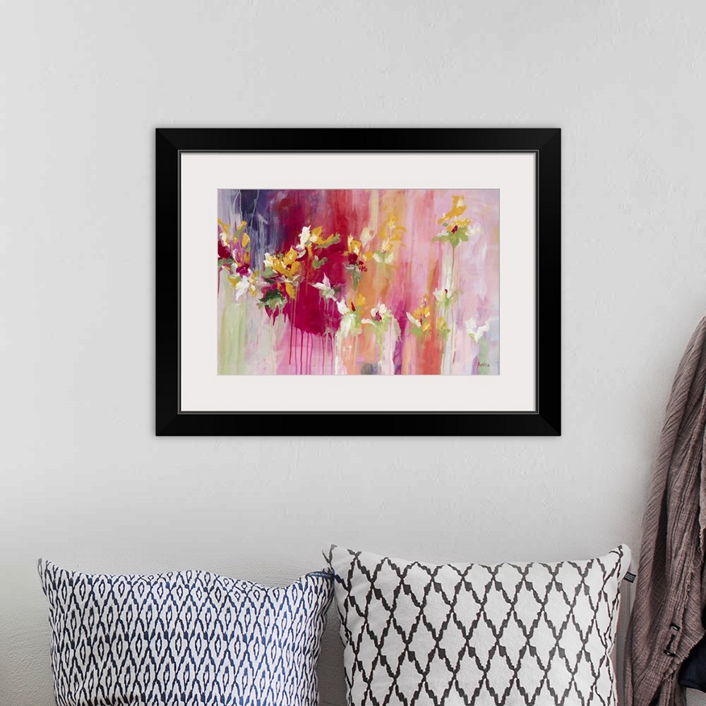 A bohemian room featuring Contemporary abstract artwork in shades of red and pink with blooming flowers.