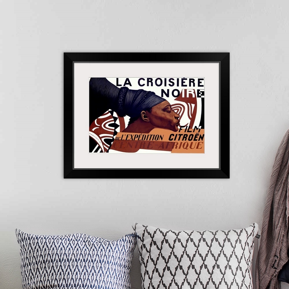 A bohemian room featuring This large piece is a vintage poster for the La Croisiere Noire with an African woman drawn in th...