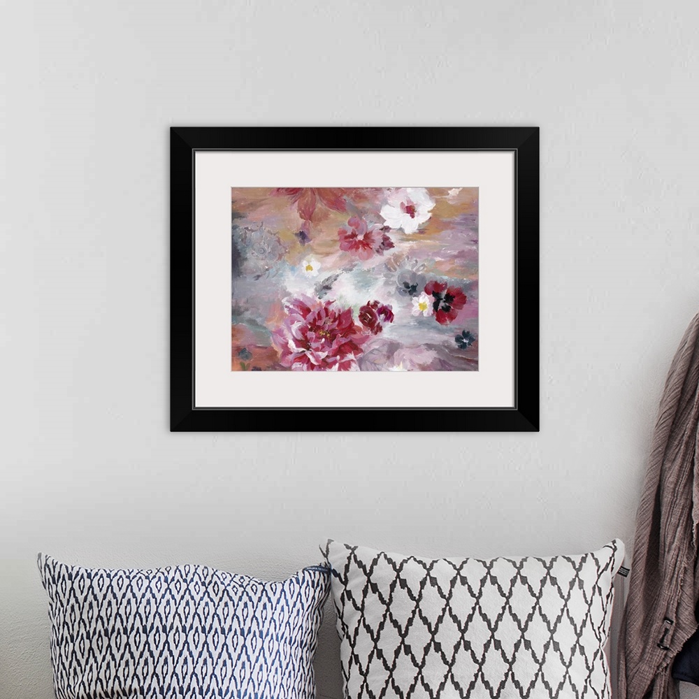A bohemian room featuring Contemporary artwork of vibrant red and soft pink flowers against a red and pale blue background.