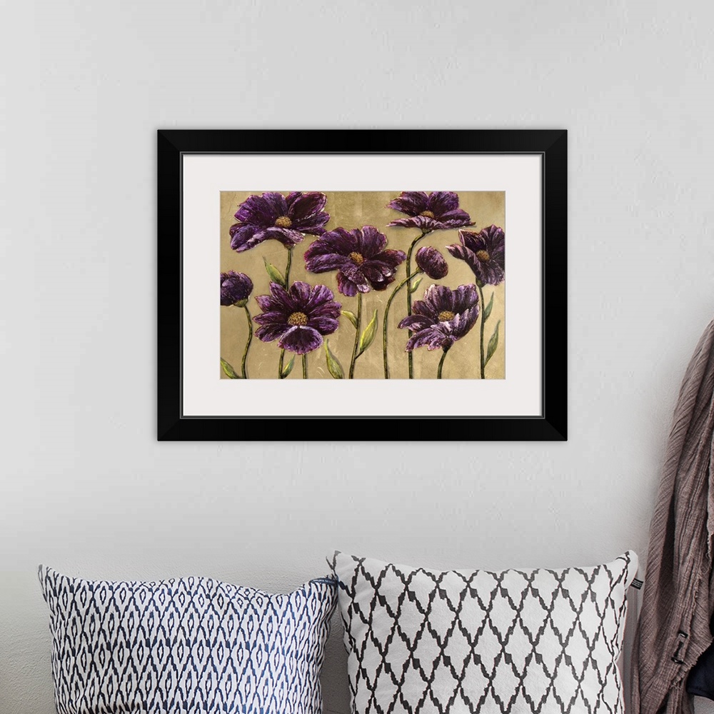 A bohemian room featuring Home decor artwork of a dark purple flowers against a brown background.