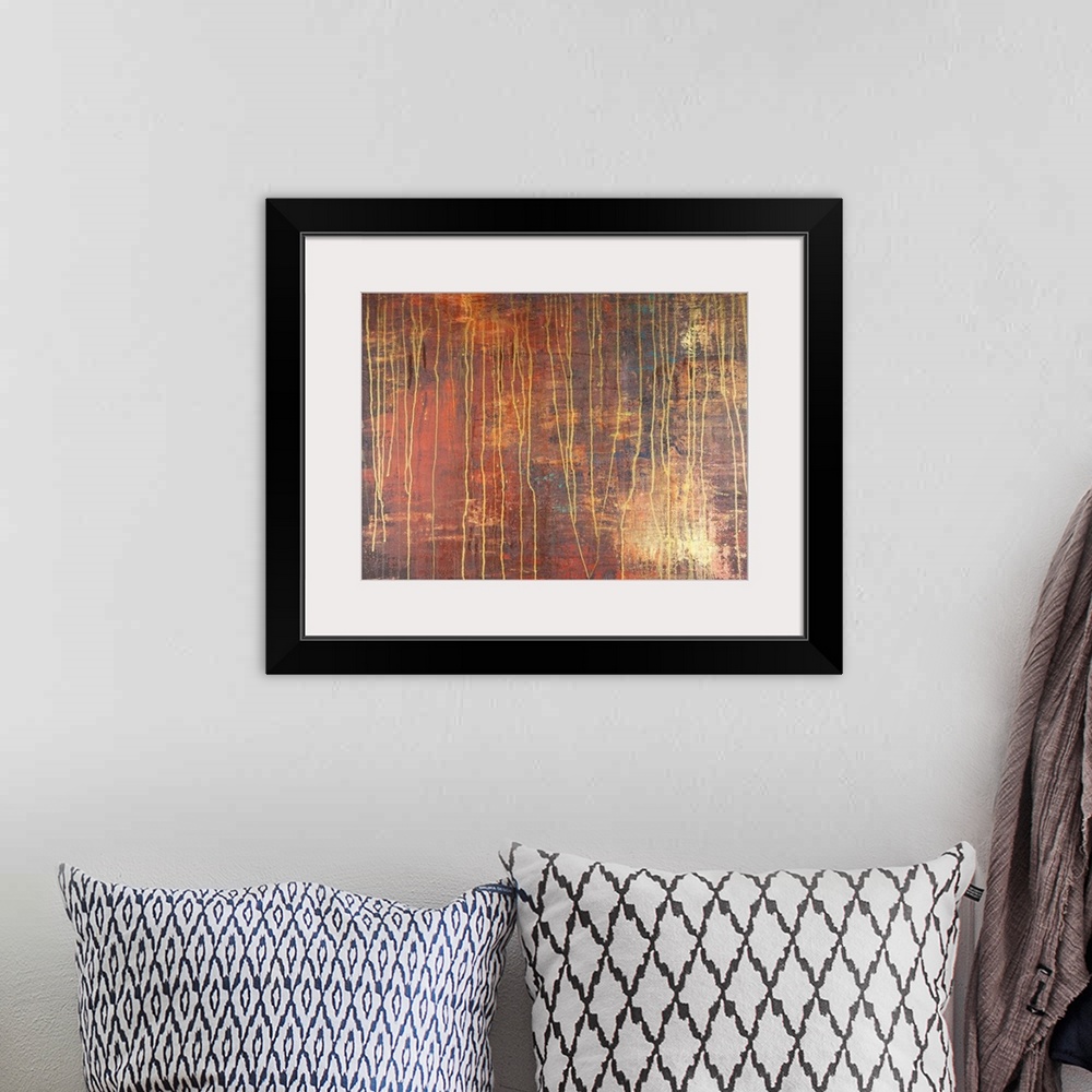 A bohemian room featuring Contemporary abstract painting resembling rust.