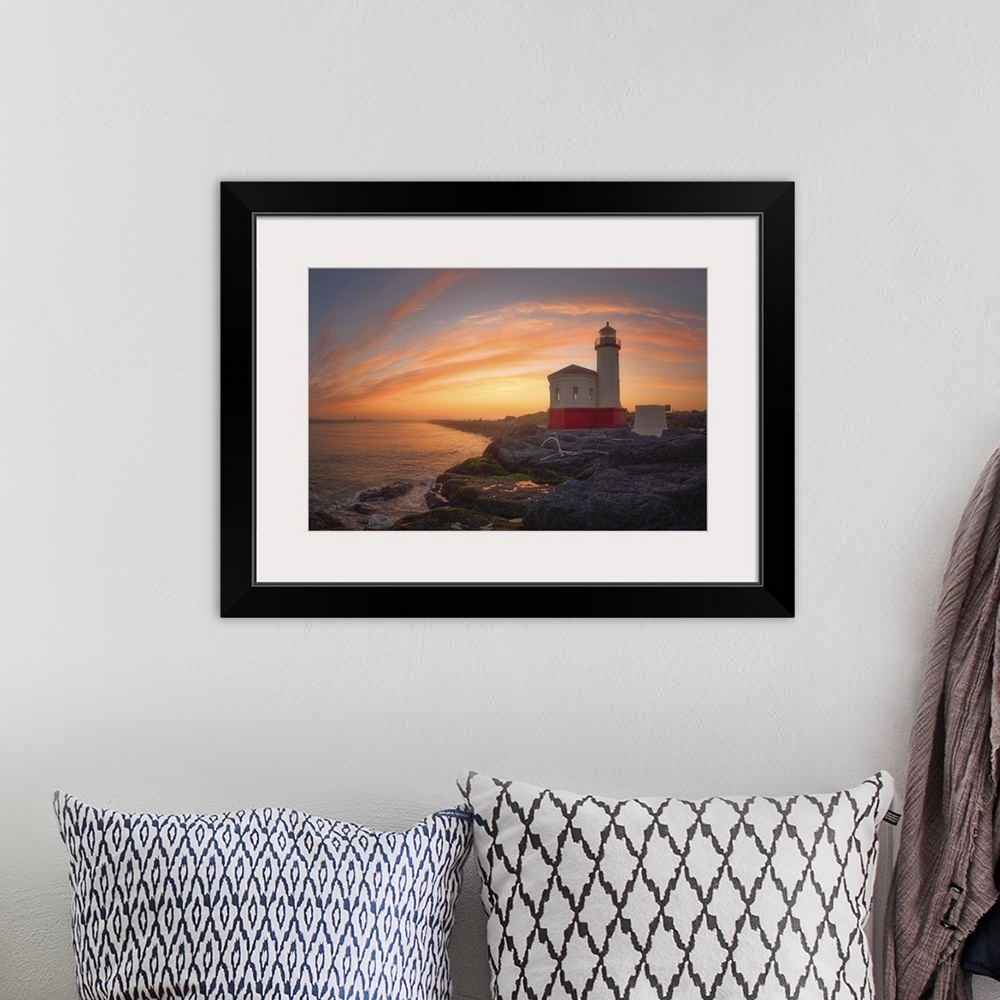 A bohemian room featuring Coquille River Light in Oregon at sunset.