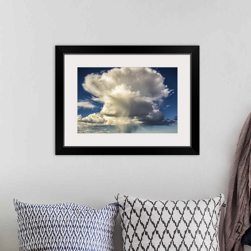 A bohemian room featuring Large cloud formation, color photography