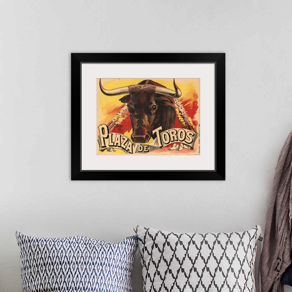 A bohemian room featuring Vintage advertisement for bull fighting.