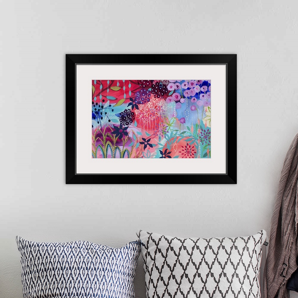 A bohemian room featuring Contemporary painting of a vibrant wildly colored flowers.