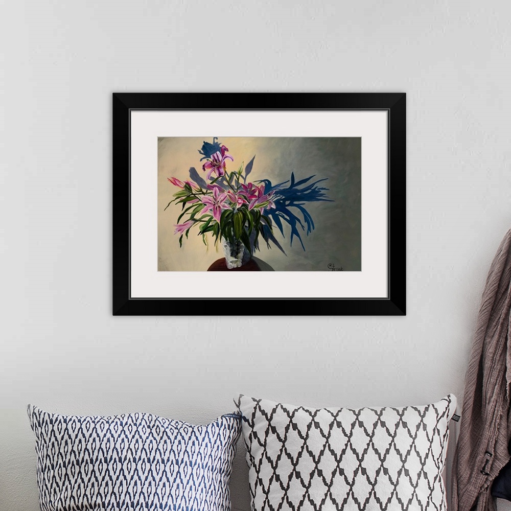 A bohemian room featuring Painting of a bouquet of pink lilies with bulky leaves in a glass vase, throwing a shadow on the ...