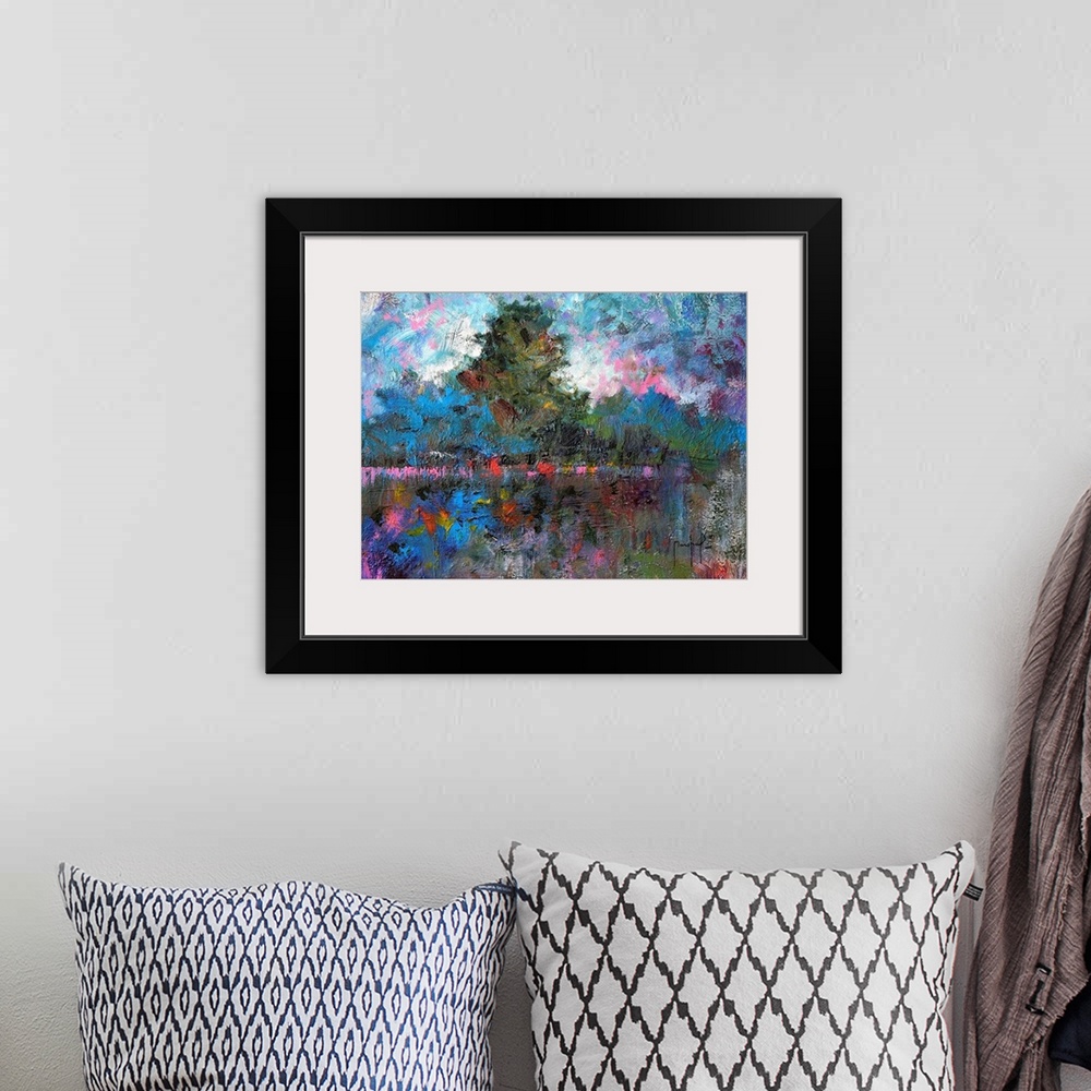 A bohemian room featuring Abstract painting of a tree lined landscape covered in bright pops of pink, red, purple, blue, an...