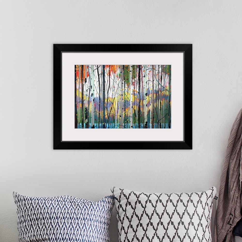 A bohemian room featuring Contemporary painting of a forest full of colorful trees in tones of red, yellow and orange with ...