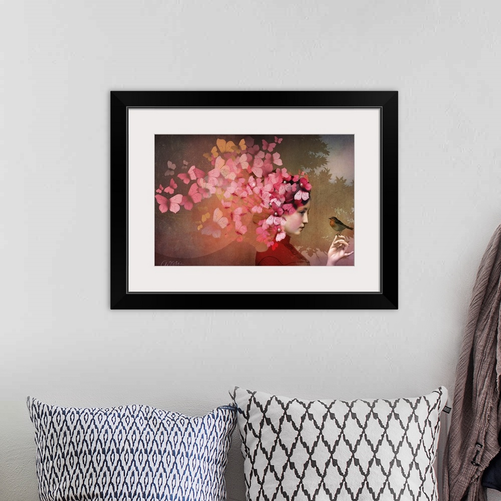 A bohemian room featuring A horizontal image of a lady with a bird.  A group of red and pink butterflies are fluttering fro...