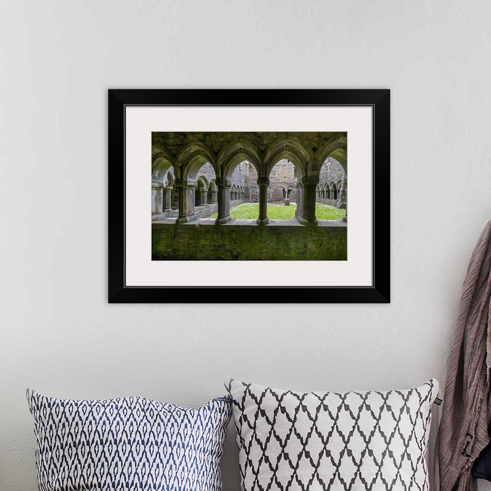 A bohemian room featuring Ancient cloisters surround this patch of grass at Moyne Abbey, County Mayo, Ireland.