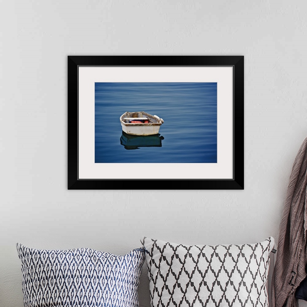 A bohemian room featuring Single small boat floating on ocean, Maine
