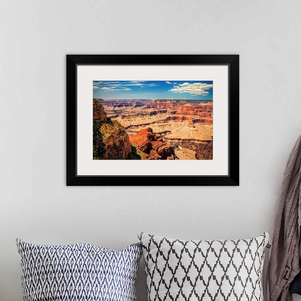 A bohemian room featuring Grand Canyon on a sunny day with blue sky.