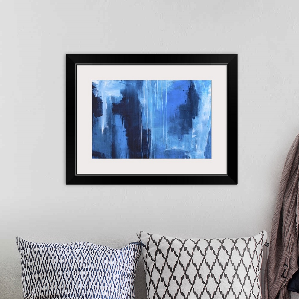 A bohemian room featuring Large abstract painting created with shades of blue and dripping white paint.
