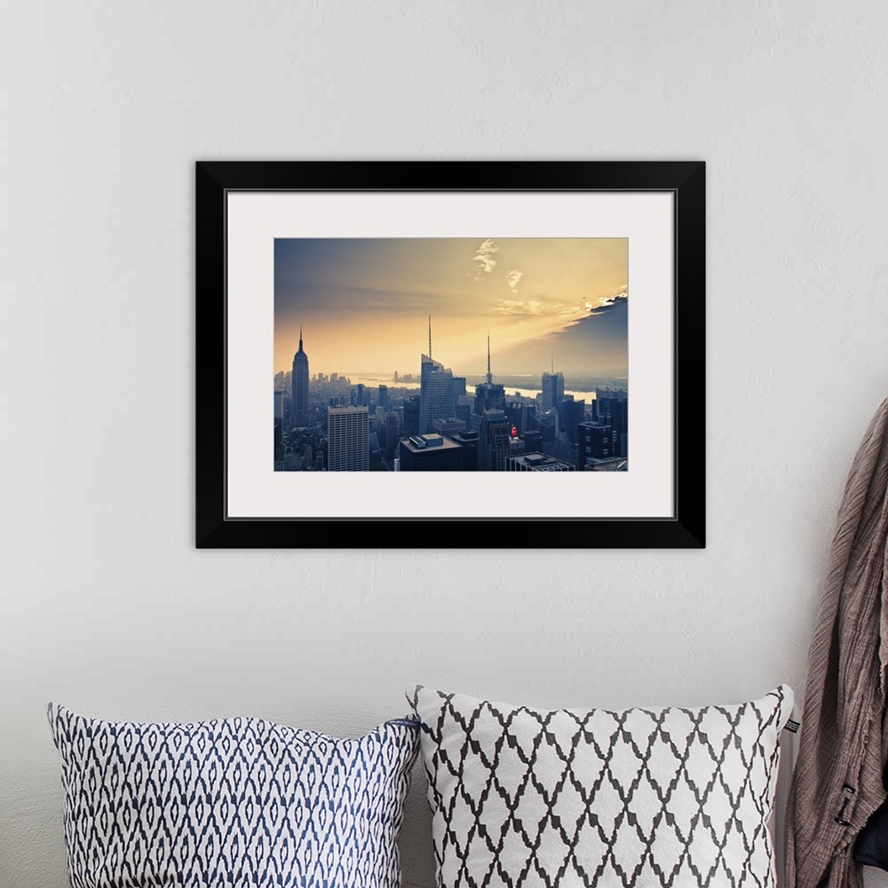 A bohemian room featuring Empire State Building and airplane flying into clouds.