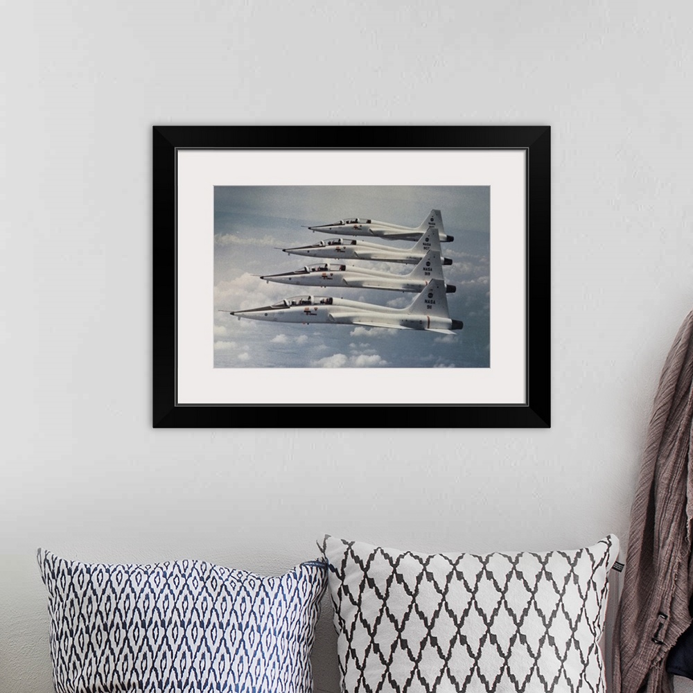 A bohemian room featuring Four Northrop T-38 Talon jet trainers