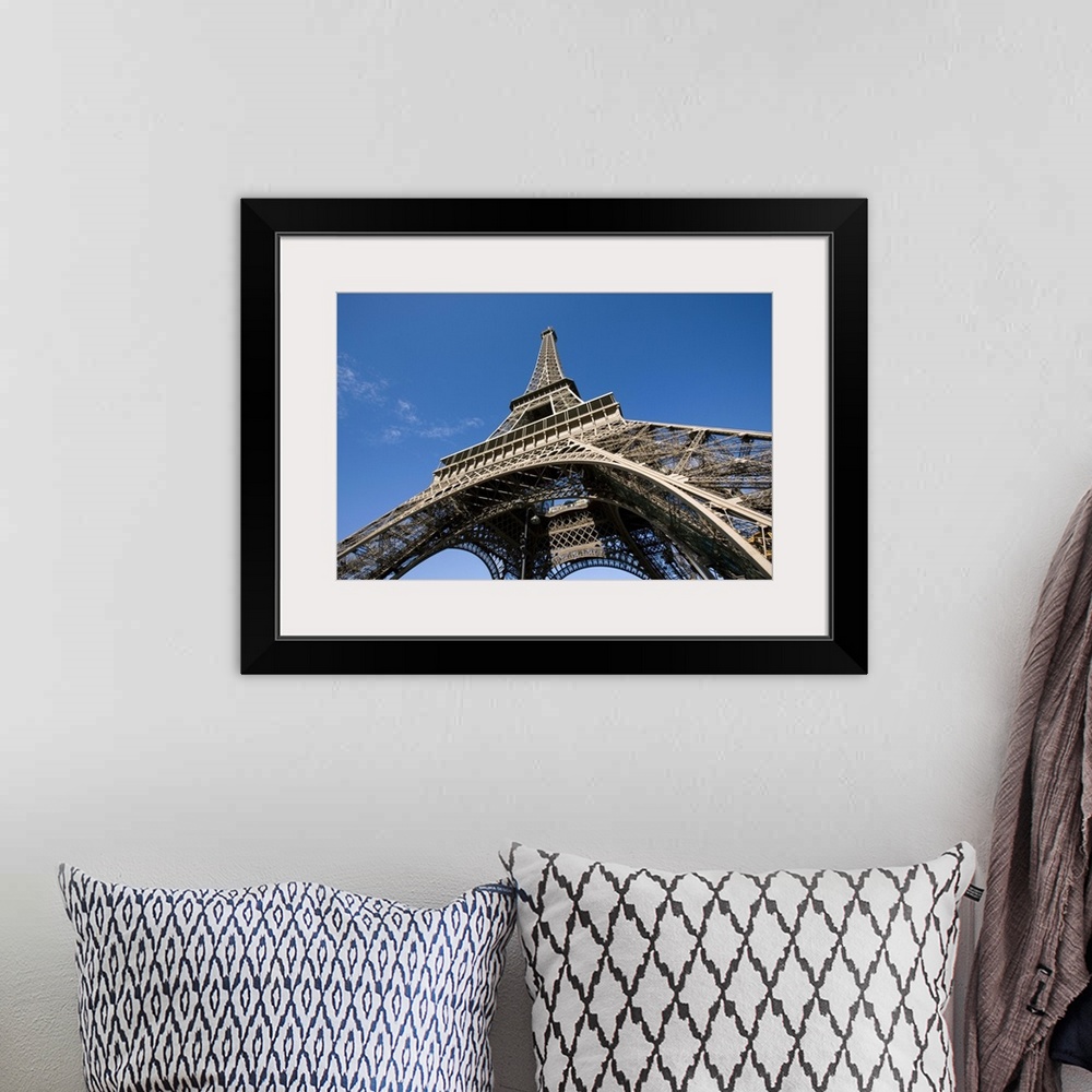 A bohemian room featuring wide view looking up at the Eiffel Tower