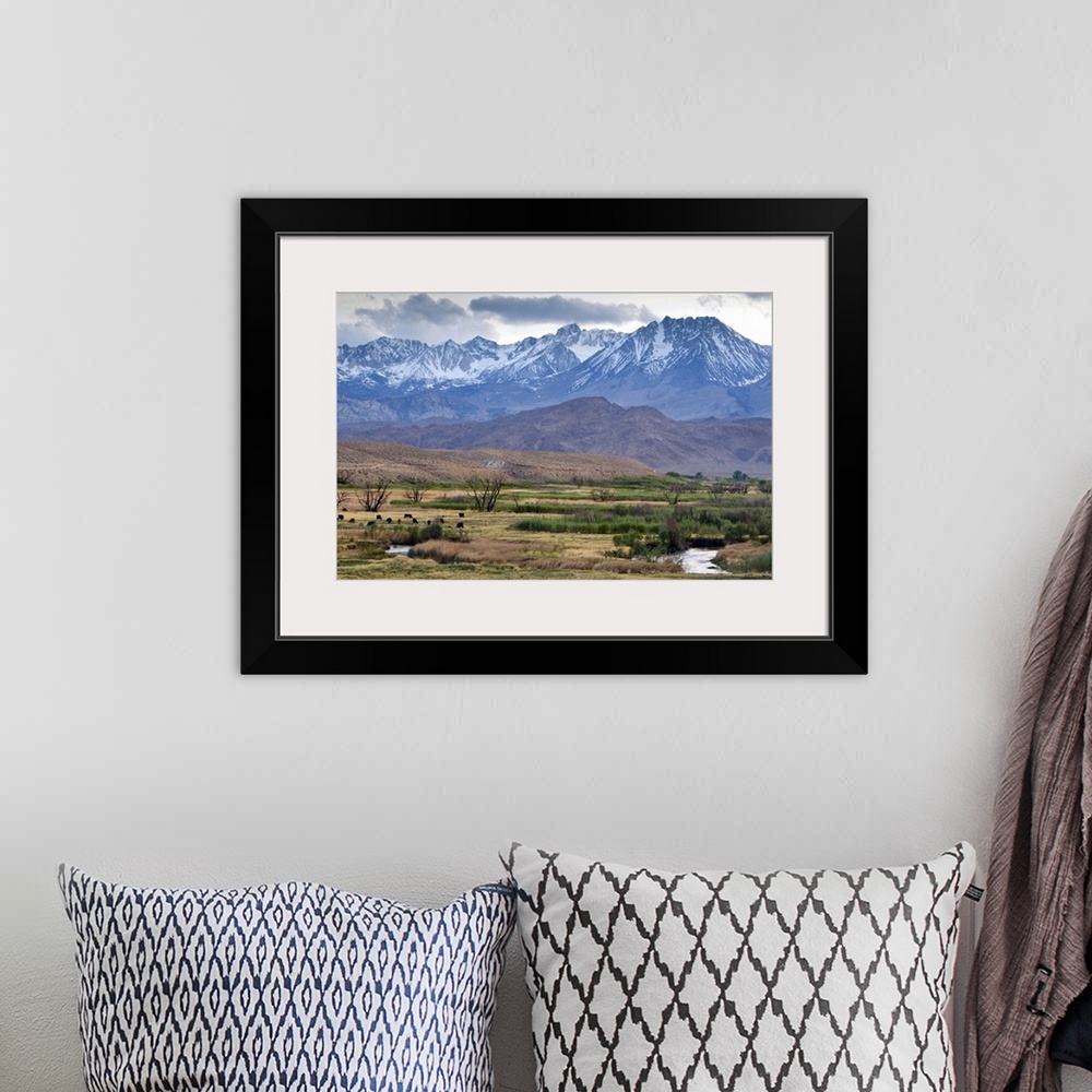 A bohemian room featuring The Eastern Sierra Nevada mountains rise above the Owens River just outside of Bishop, CA.