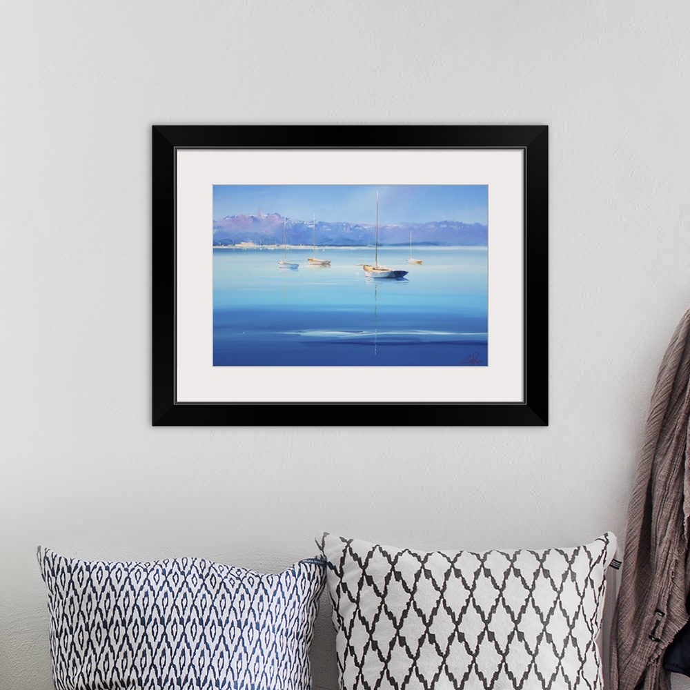 A bohemian room featuring Contemporary artwork of sailboats on deep blue water off the Italian coast.