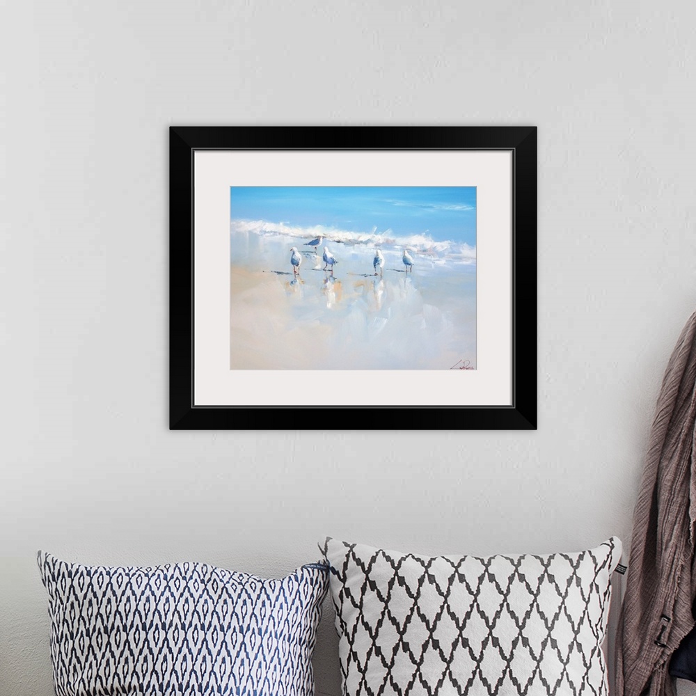 A bohemian room featuring A contemporary painting of seagulls walking along the beach waves.