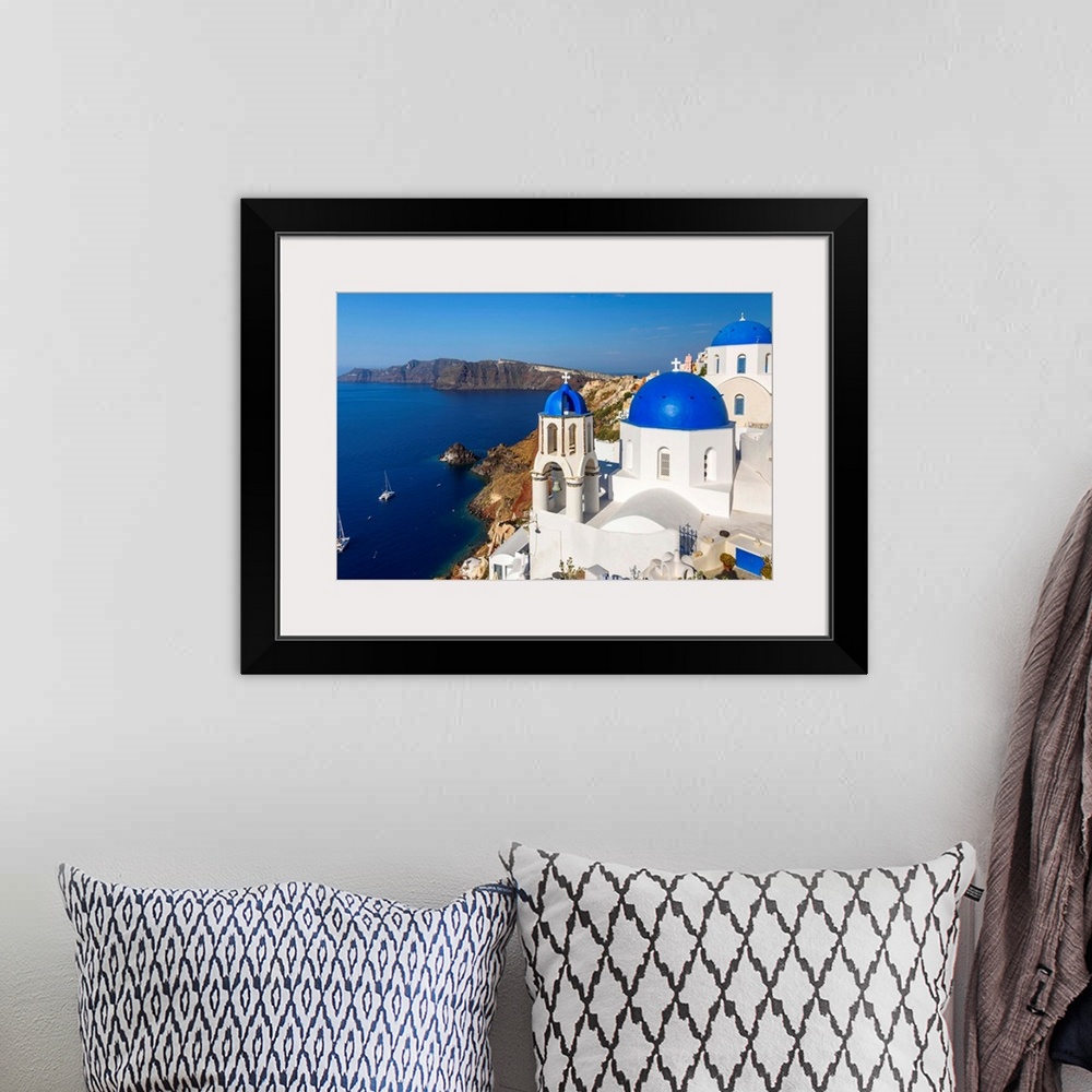 A bohemian room featuring Church with blue domes in Oia, Santorini, South Aegean, Greece