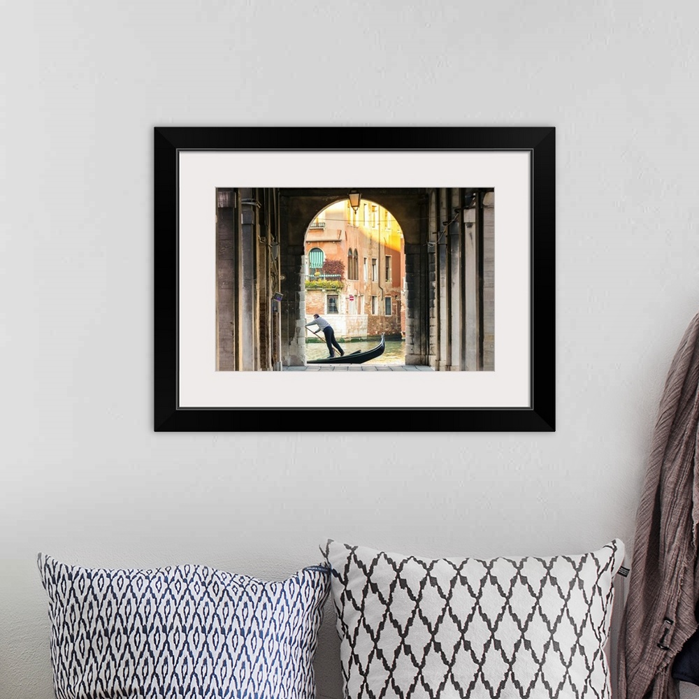 A bohemian room featuring Italy, Veneto, Venice. Gondola passing on Grand canal seen from a colonnade