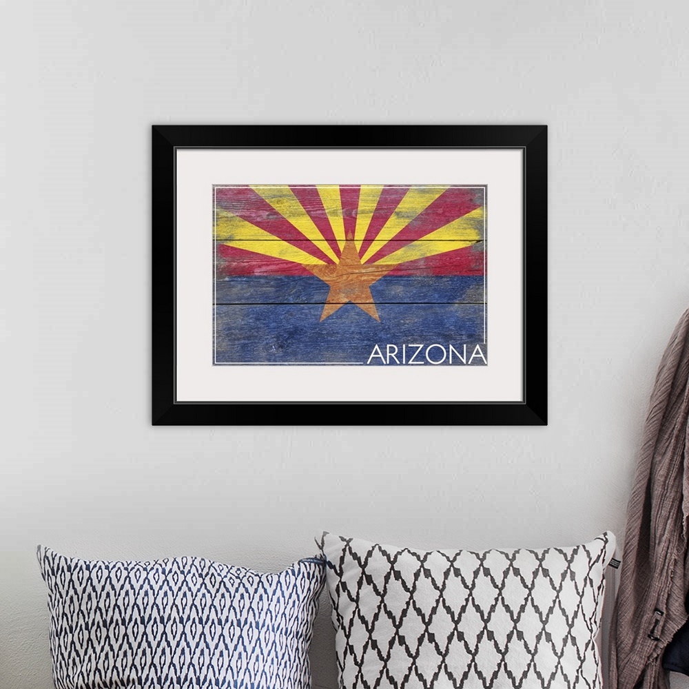 A bohemian room featuring The flag of Arizona with a weathered wooden board effect.