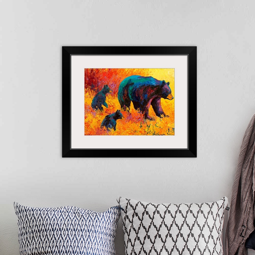 A bohemian room featuring Contemporary artwork of a mother black bear with her two cubs by her side amongst warmly colored ...