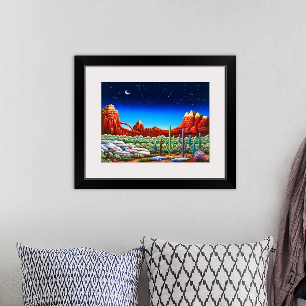 A bohemian room featuring Painting of a desert landscape under a starry night sky.