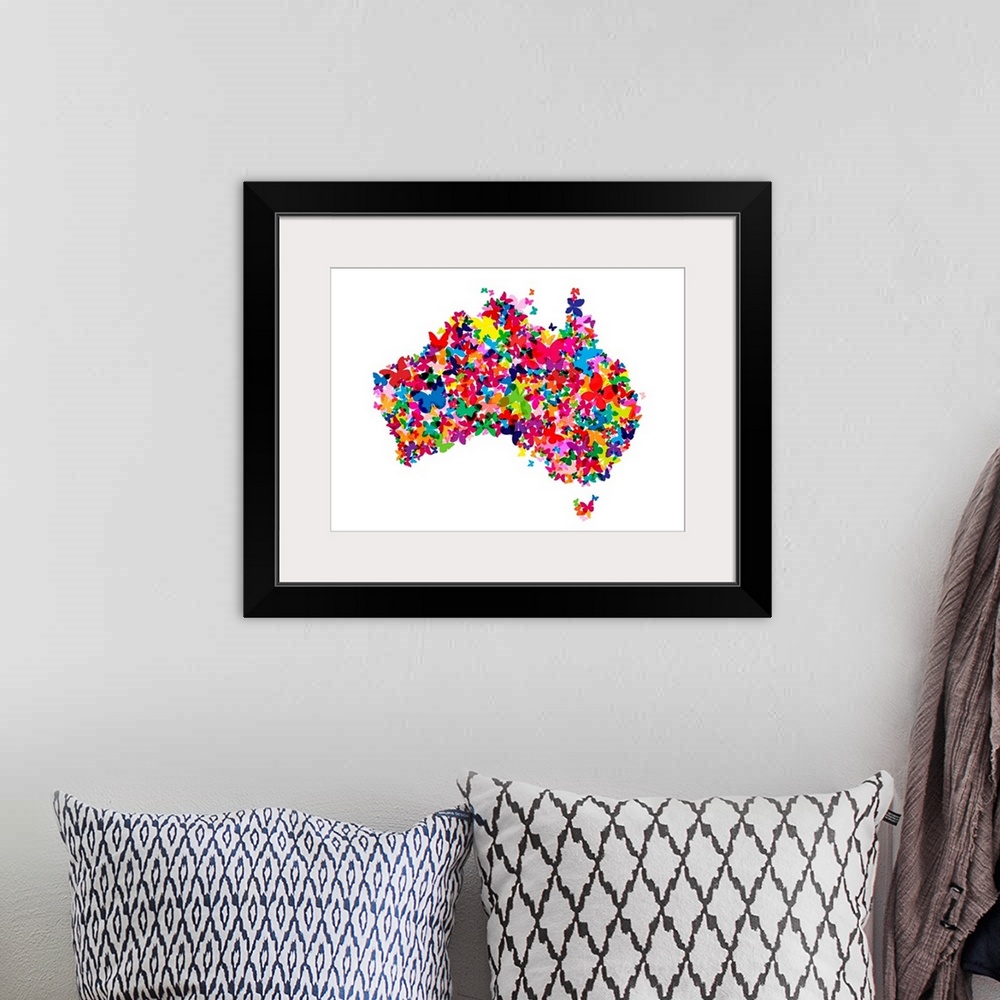 A bohemian room featuring Contemporary piece of artwork of a map of Australia made of colorful butterflies.