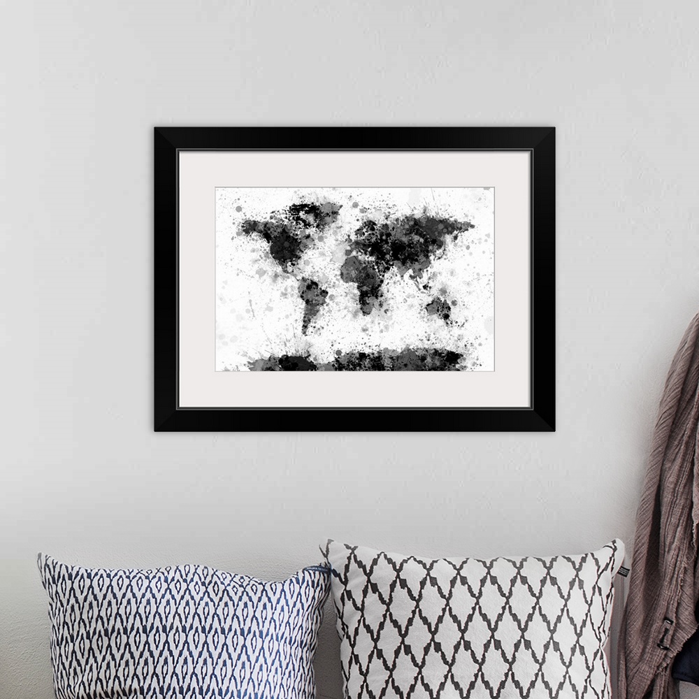 A bohemian room featuring Contemporary artwork of a world map made from black and gray toned paint splatters.