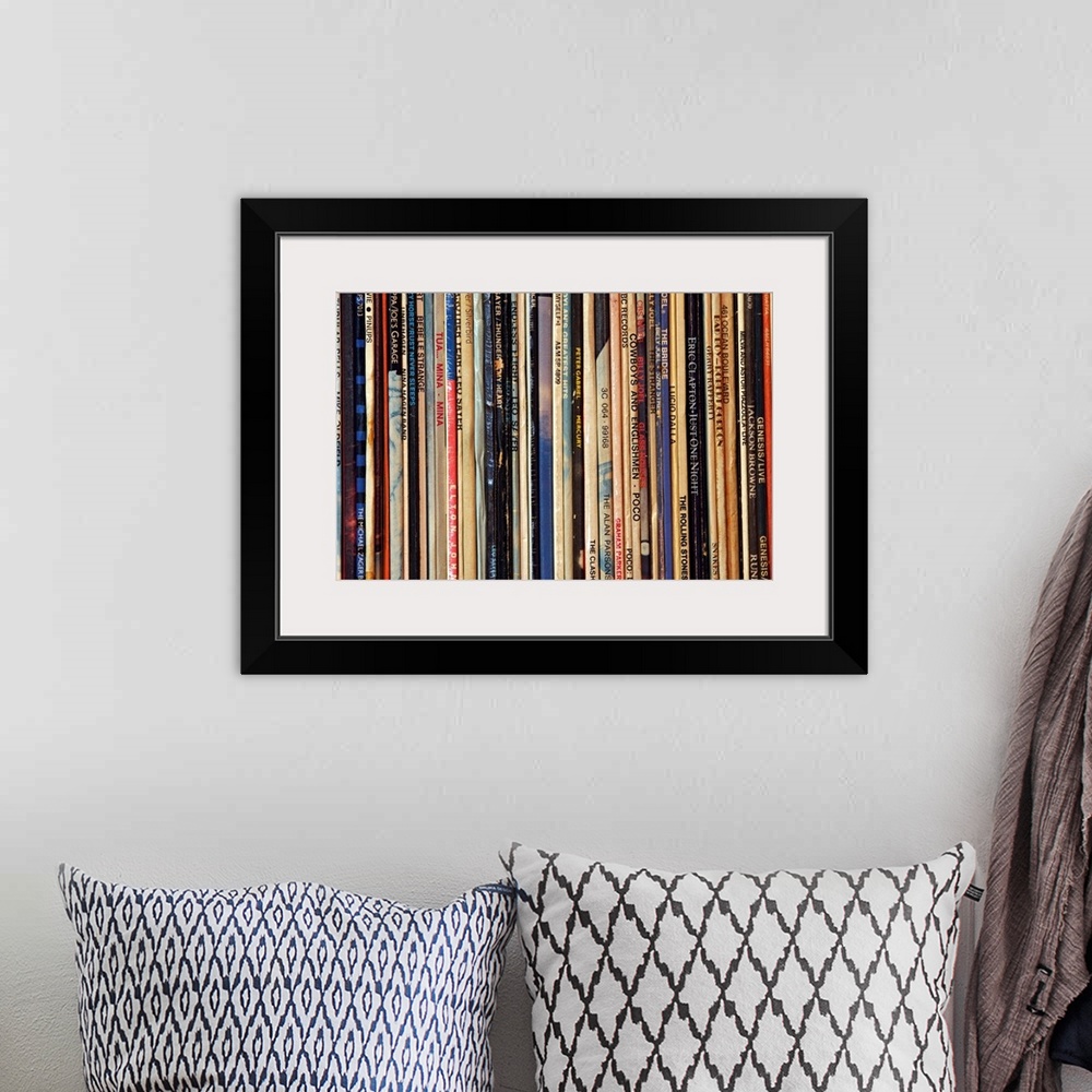 A bohemian room featuring Big photograph shows a large collection of LP vinyl records that includes works from artists such...