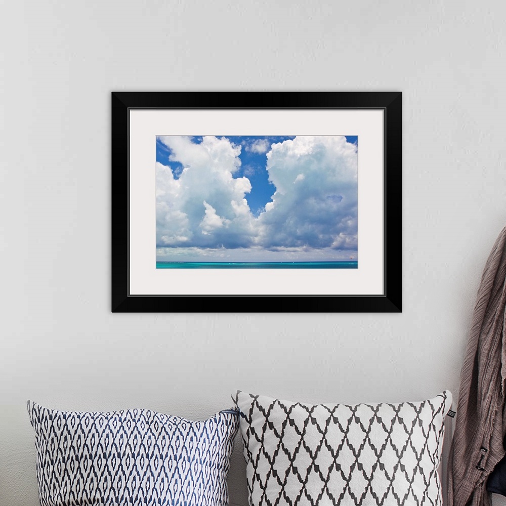 A bohemian room featuring Large clouds over Grace Bay, in the Turks and Caicos Islands.