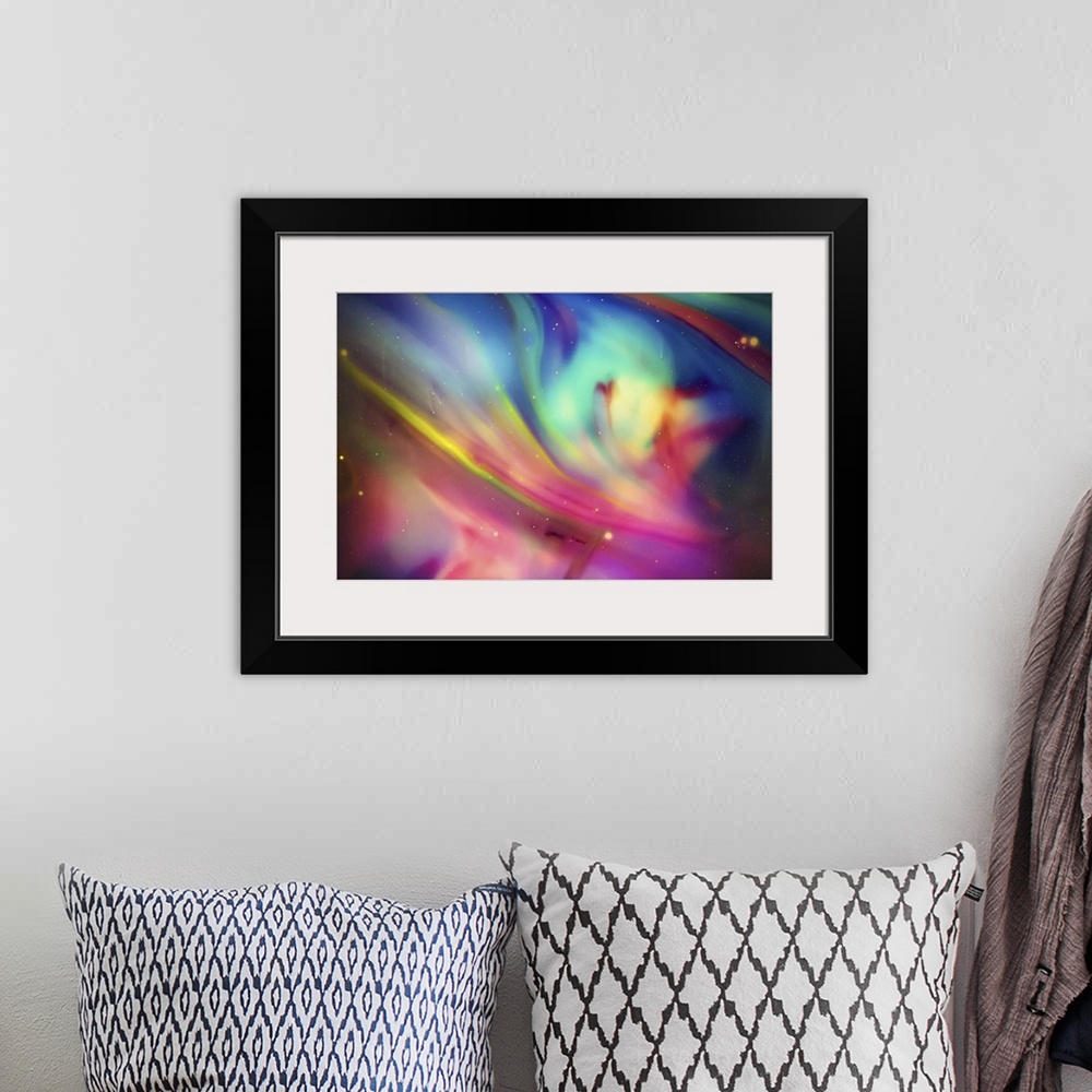 A bohemian room featuring Abstract photograph of blurred and blended neon rainbow colors and flowing lines.
