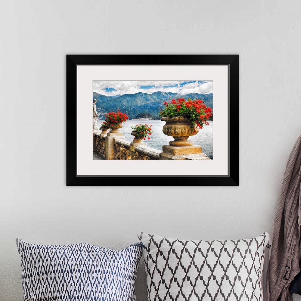 A bohemian room featuring Fine art photo of a stone wall with urns full of blooming flowers, Lake Como, Italy.