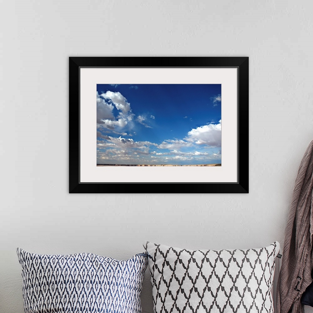 A bohemian room featuring Beautiful blue sky with heavy clouds
