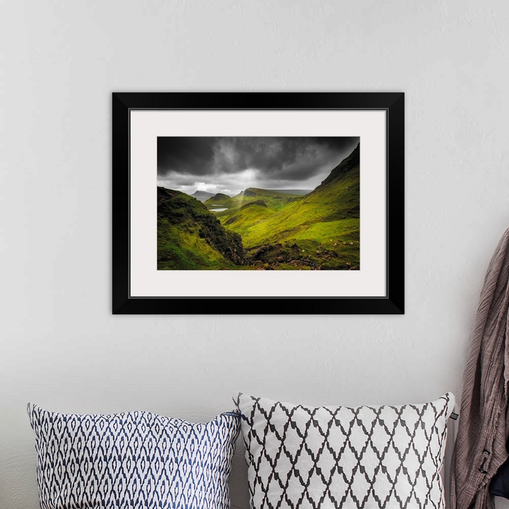 A bohemian room featuring Fine art photo of a lush valley under a stormy sky.