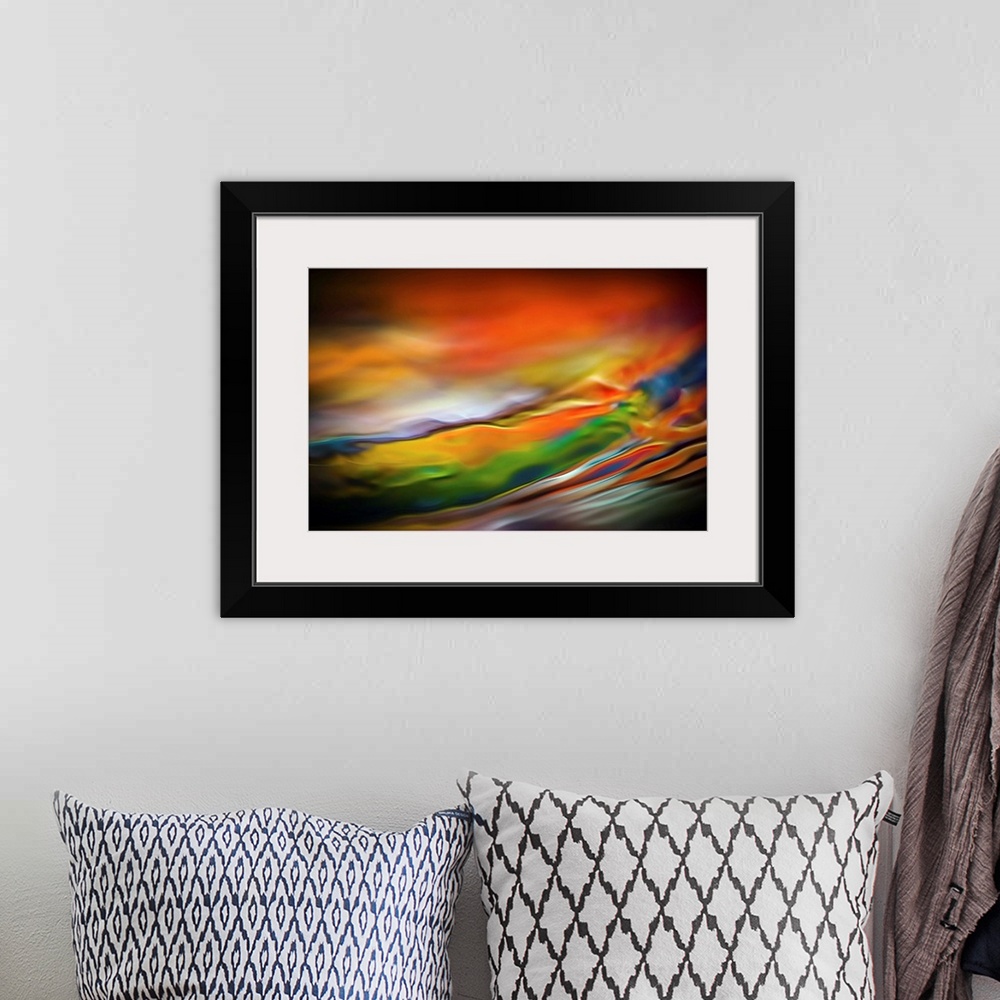 A bohemian room featuring Abstract art with colorful waves of color running horizontally and going towards the top across t...