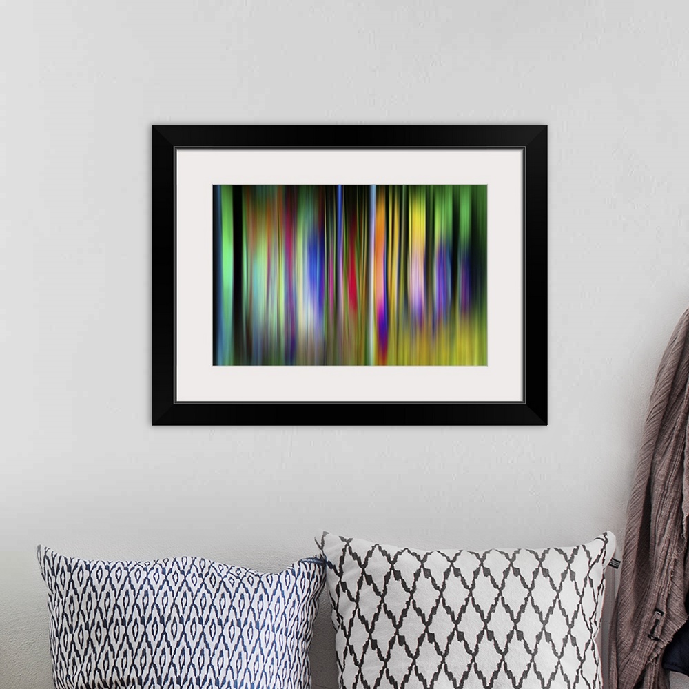 A bohemian room featuring Abstract image of colorful vertical bands resembling neon trees.